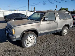 1986 Chevrolet Blazer z VIN 1G8CT18RXG8180574, wystawiony jako Copart lot #87987925 z przebiegiem 82 571 mil mil oraz Szkoda całkowita • Salvage title. Historia ofert i sprzedaży dostępna na DreamBid. Obrazek 1.