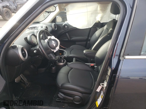 2012 MINI Countryman S with VIN WMWZC5C55CWL64092, listed as a Copart auction lot 50703855 with 69,785 mi miles and Salvage Title. Bid and sale history available at DreamBid. Image 7.