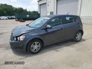 2012 Chevrolet Sonic LT with VIN 1G1JC6SHXC4218129, listed as a Copart auction lot 57330075 with 136,885 mi miles and Salvage title. Bid and sale history available at DreamBid. Image 1.