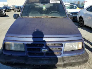 1998 Chevrolet Tracker z VIN 2CNBJ1863W6906496, wystawiony jako Copart lot #87368314 z przebiegiem 144 557 mil mil oraz Czysty tytuł • Clean title. Historia ofert i sprzedaży dostępna na DreamBid. Obrazek 6.
