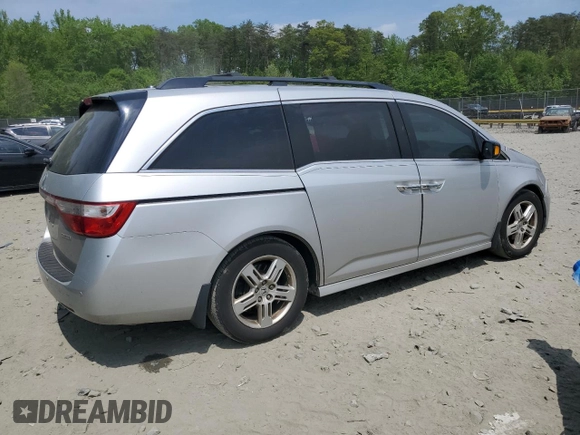 2012 Honda Odyssey Touring with VIN 5FNRL5H93CB121366, listed as a Copart auction lot 55383885 with 197,885 mi miles and Salvage title. Bid and sale history available at DreamBid. Image 3.