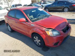 2010 Kia Rio LX with VIN KNADH4A34A6612529, listed as a IAAI auction lot 41859726 with 199,580 mi miles. Bid and sale history available at carsss.com. Image 1.