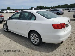 2014 Volkswagen Jetta SE with VIN 3VWD17AJ2EM391314, listed as a Copart auction lot 57357575 with 131,968 mi miles and Salvage title. Bid and sale history available at DreamBid. Image 2.