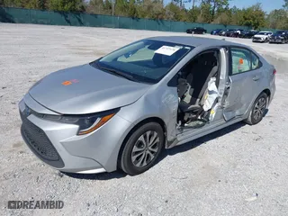 2022 Toyota Corolla Hybrid LE with VIN JTDEAMDE3NJ051851, listed as a IAAI auction lot 41727170 with 81,437 mi miles. Bid and sale history available at carsss.com. Image 16.