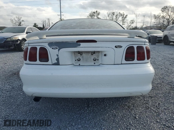 1997 Ford Mustang with VIN 1FALP4044VF174876, listed as a Copart auction lot 41601355 with 103,828 mi miles and Salvage Title. Bid and sale history available at carsss.com. Image 6.