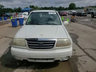 2002 Suzuki XL7 Standard z VIN JS3TY92V024106089, wystawiony jako Copart lot #58418685 z przebiegiem 232 254 mil mil oraz Szkoda całkowita • Salvage title. Historia ofert i sprzedaży dostępna na DreamBid. Obrazek 14.