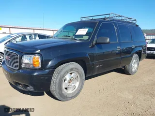 1999 GMC Denali with VIN 1GKEK13R4XR904086, listed as a IAAI auction lot 42034848 with 169,847 mi miles. Bid and sale history available at carsss.com. Image 2.