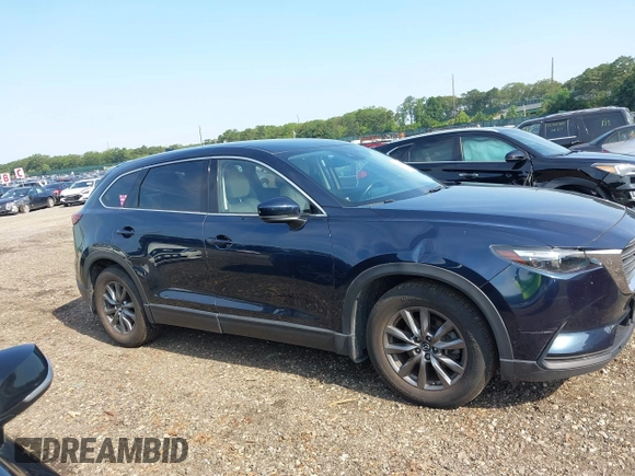 2021 Mazda CX-9 Touring with VIN JM3TCBCY7M0507699, listed as a IAAI auction lot 42603614 with 62,635 mi miles and . Bid and sale history available at DreamBid. Image 13.