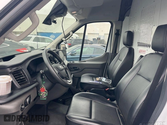 2021 Ford Transit Cargo z VIN 1FTYE1C84MKA94597, wystawiony jako IAAI lot #42704426 z przebiegiem 74 850 mil mil oraz . Historia ofert i sprzedaży dostępna na DreamBid. Obrazek 13.