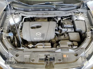 2014 Mazda CX-5 Touring z VIN JM3KE4CY5E0393463, wystawiony jako Copart lot #57776665 z przebiegiem 91 565 mil mil oraz Szkoda całkowita • Salvage title. Historia ofert i sprzedaży dostępna na DreamBid. Obrazek 11.