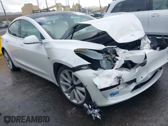 2020 Tesla Model 3 Standard Range Plus with VIN 5YJ3E1EA0LF741311, listed as a IAAI auction lot 41581931 with 43,284 mi miles. Bid and sale history available at carsss.com. Image 1.