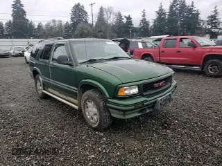 1997 GMC Jimmy SLS with VIN 1GKDT13WXV2563104, listed as a Copart auction lot 86317834 with 121,791 mi miles and Salvage Title. Bid and sale history available at carsss.com. Image 11.