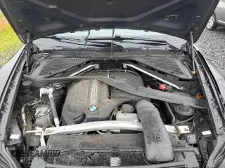 2012 BMW X5 35i with VIN 5UXZV4C57CL765053, listed as a Copart auction lot 59997275 with 157,943 mi miles and Salvage title. Bid and sale history available at DreamBid. Image 12.