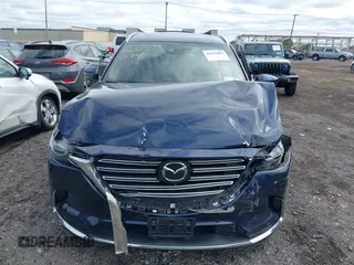 2021 Mazda CX-9 Grand Touring with VIN JM3TCBDY3M0537975, listed as a IAAI auction lot 42251894 with 50,156 mi miles and . Bid and sale history available at DreamBid. Image 12.
