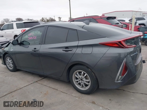 2018 Toyota Prius Plus with VIN JTDKARFPXJ3087064, listed as a IAAI auction lot 41433495 with 118,298 mi miles and . Bid and sale history available at DreamBid. Image 14.