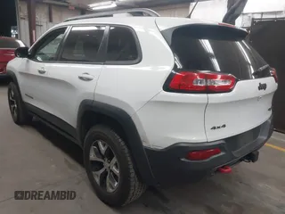 2015 Jeep Cherokee Trailhawk with VIN 1C4PJMBS1FW665500, listed as a IAAI auction lot 42068268 with 127,246 mi miles. Bid and sale history available at carsss.com. Image 3.