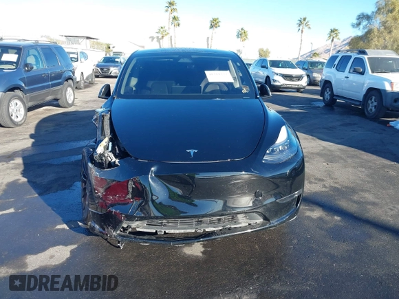 2023 Tesla Model Y Performance with VIN 7SAYGDEF6PF854797, listed as a IAAI auction lot 41319332 with 46,132 mi miles and . Bid and sale history available at DreamBid. Image 6.