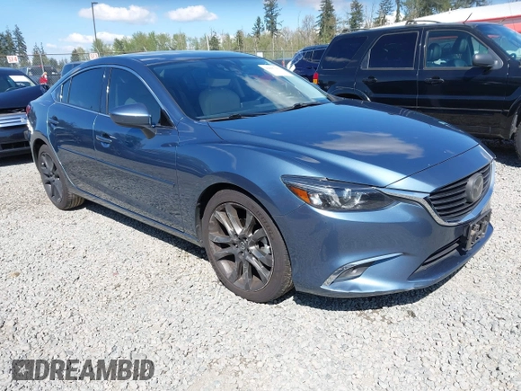 2016 Mazda Mazda6 i Grand Touring with VIN JM1GJ1W51G1436977, listed as a IAAI auction lot 42097363 with 128,941 mi miles. Bid and sale history available at carsss.com. Image 1.