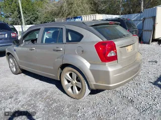 2010 Dodge Caliber SXT with VIN 1B3CB4HA4AD613312, listed as a IAAI auction lot 41746603 with 180,606 mi miles. Bid and sale history available at carsss.com. Image 3.