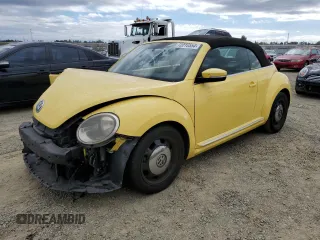 2014 Volkswagen Beetle 1.8T w/Premium z VIN 3VW517AT6EM821531, wystawiony jako Copart lot #72216554 z przebiegiem 88 088 mil mil oraz Szkoda całkowita • Salvage title. Historia ofert i sprzedaży dostępna na DreamBid. Obrazek 1.