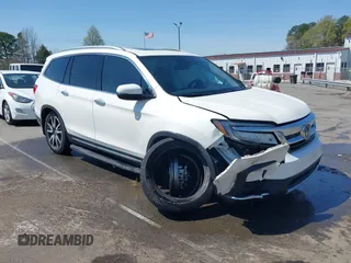 2019 Honda Pilot Touring 8-Passenger z VIN 5FNYF5H93KB021978, wystawiony jako IAAI lot #41915333 z przebiegiem 82 676 mil mil oraz . Historia ofert i sprzedaży dostępna na DreamBid. Obrazek 1.