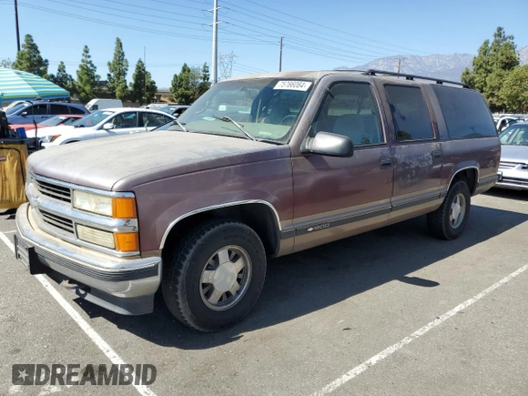 1997 Chevrolet Suburban with VIN 1GNEC16R4VJ418725, listed as a Copart auction lot 75766084 with 216,722 mi miles and Salvage Title. Bid and sale history available at carsss.com. Image 1.