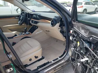 2020 Alfa Romeo Stelvio Ti z VIN ZASPAKBN8L7C95979, wystawiony jako IAAI lot #42018506 z przebiegiem 30 198 mil mil oraz . Historia ofert i sprzedaży dostępna na DreamBid. Obrazek 5.