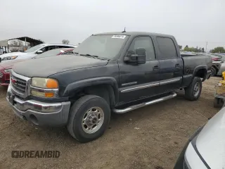 2004 GMC Sierra 2500HD SLE z VIN 1GTHK23U94F130739, wystawiony jako Copart lot #76596674 z przebiegiem 166 406 mil mil oraz Czysty tytuł • Clean title. Historia ofert i sprzedaży dostępna na DreamBid. Obrazek 1.