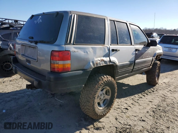 1998 Jeep Grand Cherokee Laredo with VIN 1J4GZ58S5WC295461, listed as a Copart auction lot 41787605 with 185,801 mi miles and Salvage Title. Bid and sale history available at carsss.com. Image 3.