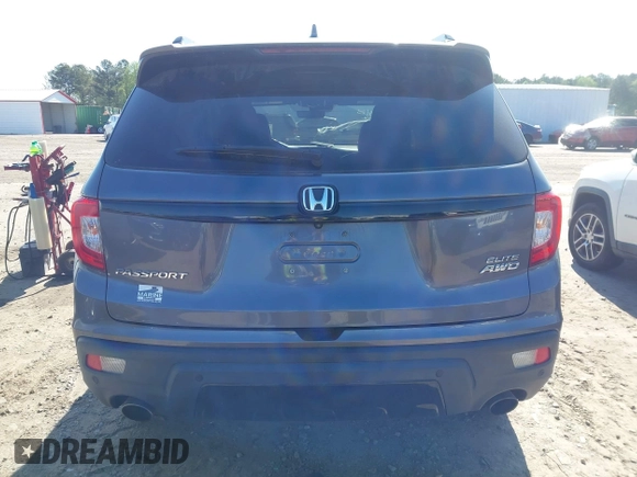 2019 Honda Passport Elite with VIN 5FNYF8H04KB004657, listed as a IAAI auction lot 41993974 with 90,964 mi miles and . Bid and sale history available at DreamBid. Image 16.