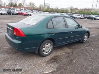 2001 Honda Civic LX with VIN 2HGES16531H556116, listed as a IAAI auction lot 42004307 with 139,074 mi miles. Bid and sale history available at carsss.com. Image 4.