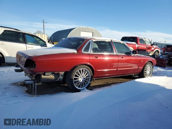 1999 Jaguar XJ with VIN SAJPD1841XC869913, listed as a Copart auction lot 41449445 with Not provided miles and Salvage title. Bid and sale history available at DreamBid. Image 3.