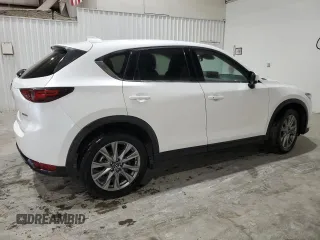 2021 Mazda CX-5 Grand Touring with VIN JM3KFBDM4M1344602, listed as a Copart auction lot 82793724 with 69,322 mi miles and Salvage Title. Bid and sale history available at carsss.com. Image 3.