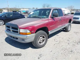 1999 Dodge Dakota SLT z VIN 1B7GL22X2XS222162, wystawiony jako IAAI lot #42038943 z przebiegiem 222 883 mil mil oraz . Historia ofert i sprzedaży dostępna na DreamBid. Obrazek 2.