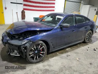 2024 BMW i4 M50 z VIN WBY33AW03RFR95593, wystawiony jako Copart lot #52070055 z przebiegiem 22 126 mil mil oraz Szkody całkowita. Historia ofert i sprzedaży dostępna na DreamBid. Obrazek 1.