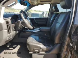 2014 Nissan Titan Pro-4X with VIN 1N6AA0EC2EN519983, listed as a Copart auction lot 71496934 with 150,259 mi miles and Salvage title. Bid and sale history available at DreamBid. Image 7.