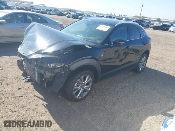 2022 Mazda CX-30 S Premium with VIN 3MVDMBDL6NM407913, listed as a IAAI auction lot 42359860 with 35,804 mi miles and . Bid and sale history available at DreamBid. Image 2.