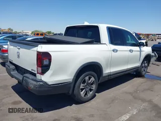 2019 Honda Ridgeline RTL-E with VIN 5FPYK3F74KB009279, listed as a IAAI auction lot 42348773 with 98,141 mi miles and . Bid and sale history available at DreamBid. Image 4.