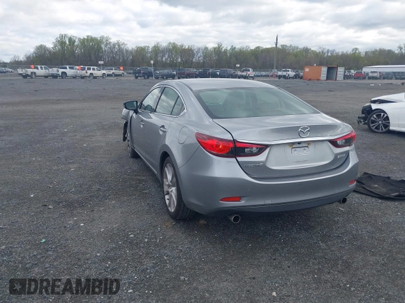 2014 Mazda 6 i Touring with VIN JM1GJ1V64E1147549, listed as a IAAI auction lot 42041025 with 124,400 mi miles and . Bid and sale history available at DreamBid. Image 3.