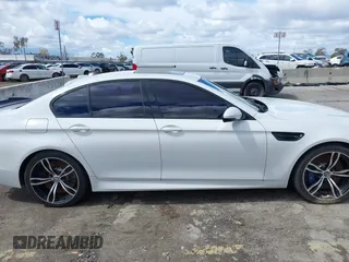 2013 BMW M5 with VIN WBSFV9C56DC772961, listed as a IAAI auction lot 41765457 with 104,568 mi miles. Bid and sale history available at carsss.com. Image 13.