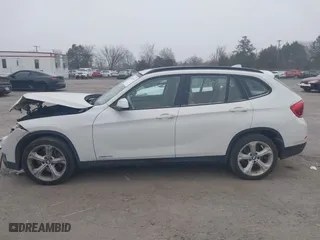 2013 BMW X1 xDrive35i with VIN WBAVM5C53DVV89288, listed as a IAAI auction lot 41609285 with 114,659 mi miles. Bid and sale history available at carsss.com. Image 14.