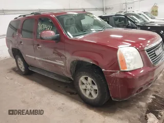 2011 GMC Yukon SLT with VIN 1GKS2CE08BR308792, listed as a IAAI auction lot 41633427 with 216,483 mi miles. Bid and sale history available at carsss.com. Image 1.