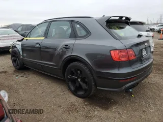 2019 Bentley Bentayga V8 z VIN SJAAM2ZV3KC027120, wystawiony jako Copart lot #83595274 z przebiegiem 28 972 mil mil oraz Szkoda całkowita • Salvage title. Historia ofert i sprzedaży dostępna na DreamBid. Obrazek 2.