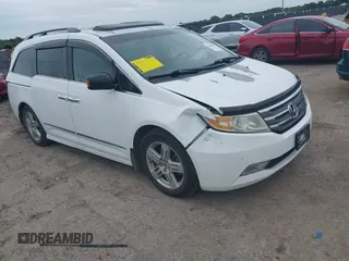 2011 Honda Odyssey Touring with VIN 5FNRL5H97BB054799, listed as a IAAI auction lot 42480197 with 185,267 mi miles and . Bid and sale history available at DreamBid. Image 1.