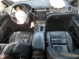 2021 Jeep Grand Cherokee 80th Anniversary with VIN 1C4RJFBG7MC665757, listed as a Copart auction lot 52443235 with 99,828 mi miles and Salvage Title. Bid and sale history available at DreamBid. Image 8.