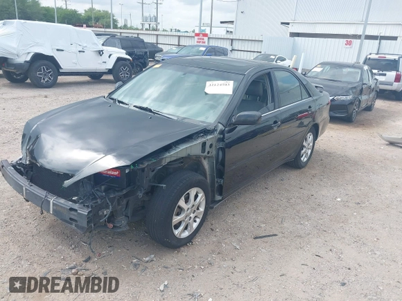 2005 Toyota Camry LE with VIN 4T1BF32K15U091945, listed as a IAAI auction lot 42124503 with 212,951 mi miles and . Bid and sale history available at DreamBid. Image 2.