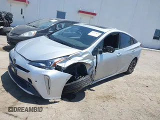 2022 Toyota Prius L Eco with VIN JTDKAMFU5N3188107, listed as a IAAI auction lot 42223649 with 180,894 mi miles and . Bid and sale history available at DreamBid. Image 2.