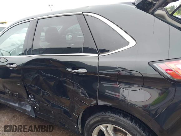2015 Ford Edge Titanium z VIN 2FMTK4K96FBB24674, wystawiony jako IAAI lot #42403892 z przebiegiem 113 816 mil mil oraz . Historia ofert i sprzedaży dostępna na DreamBid. Obrazek 6.