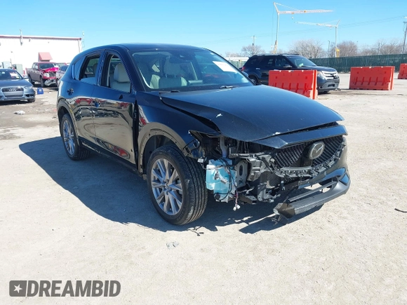 2020 Mazda CX-5 Grand Touring with VIN JM3KFBDMXL0763316, listed as a IAAI auction lot 41661958 with 64,881 mi miles and . Bid and sale history available at carsss.com. Image 1.