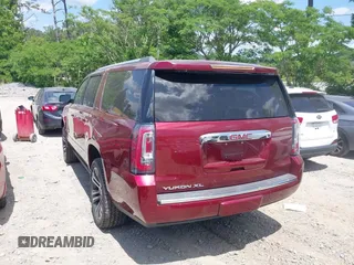 2018 GMC Yukon XL Denali z VIN 1GKS1HKJ6JR312495, wystawiony jako IAAI lot #42177446 z przebiegiem 94 268 mil mil oraz . Historia ofert i sprzedaży dostępna na DreamBid. Obrazek 3.
